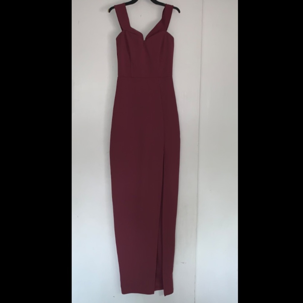 Maroon purple long dress. Has a slit on the left side. Has a zipper on the back.